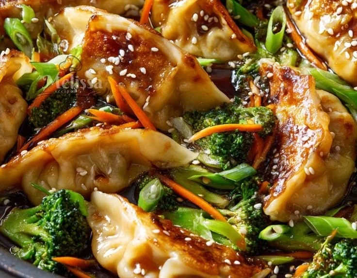 A delicious beef potstickers stir fry served in a bowl with colorful vegetables.