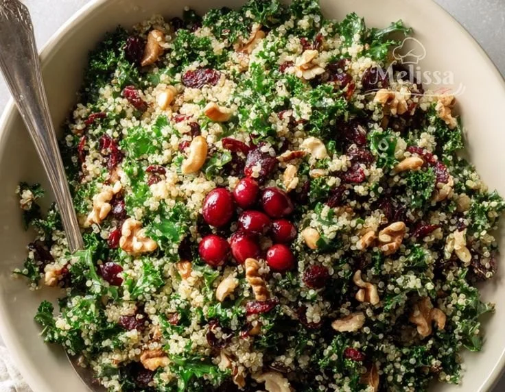 Cranberry Kale Quinoa Salad with Candied Pecans and Feta served in a bowl