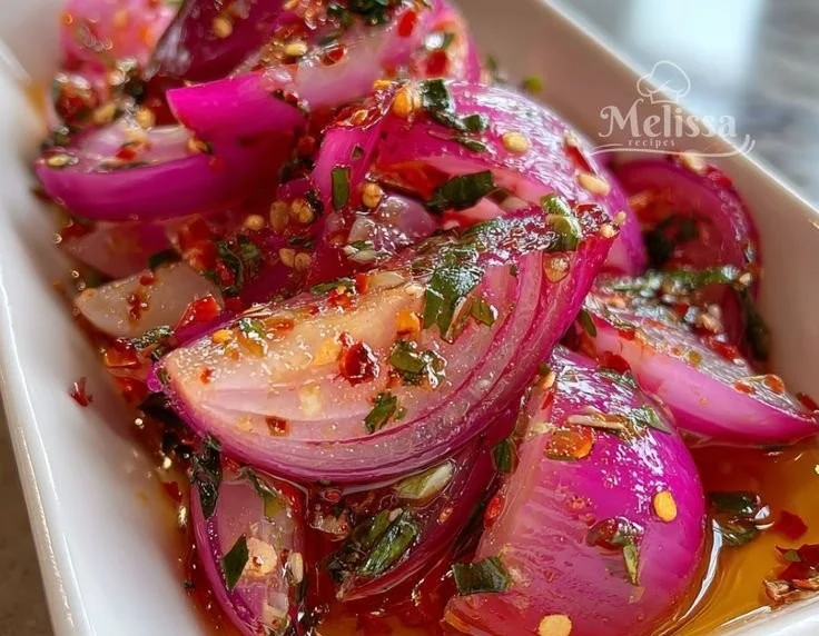 Jar of hot honey pickled red onions on a kitchen counter