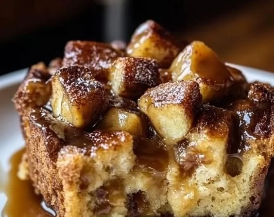 Irresistible Caramel Apple Bread Pudding with caramel drizzle and apple slices