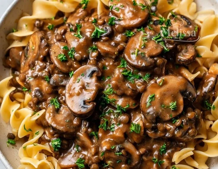Delicious Lentil Mushroom Stroganoff served in a bowl with a sprinkle of herbs