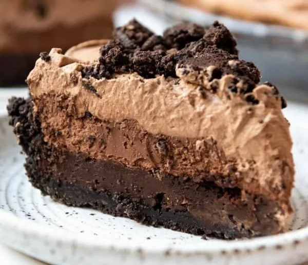 Delicious Mississippi Mud Pie topped with whipped cream and chocolate