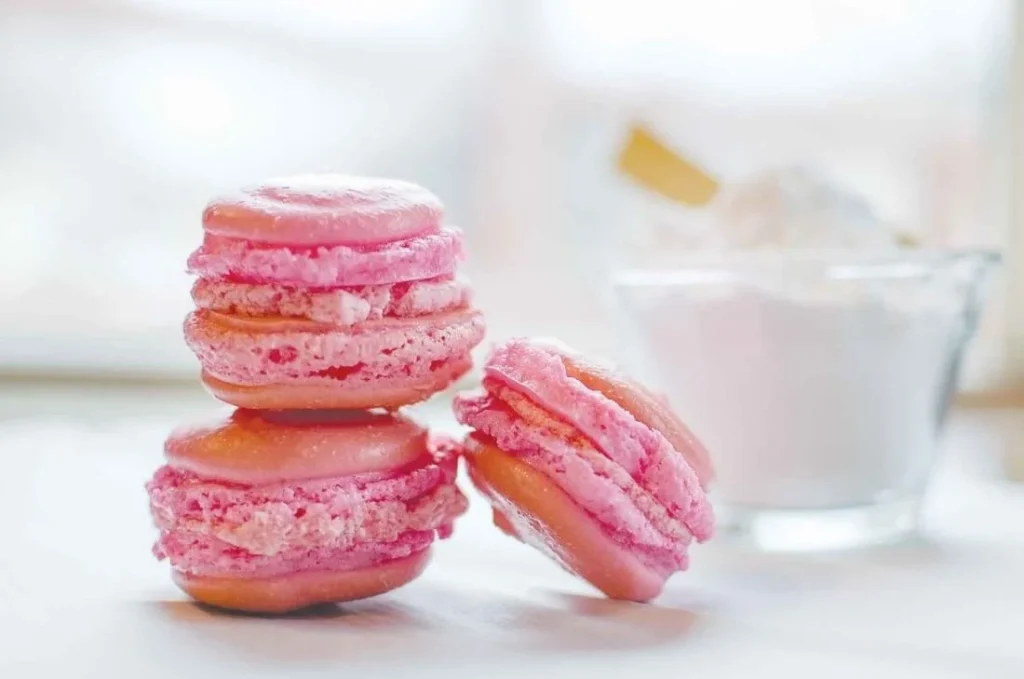 Perfectly baked macarons on a decorative plate