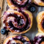 Delicious blueberry cinnamon rolls with a sweet glaze on a plate