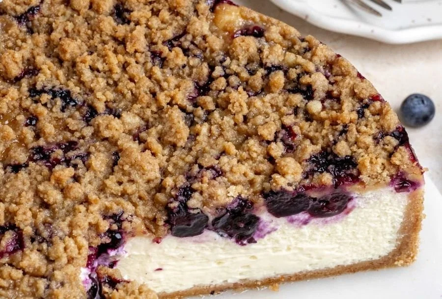 Delicious blueberry crumble cheesecake with a buttery crumble topping.
