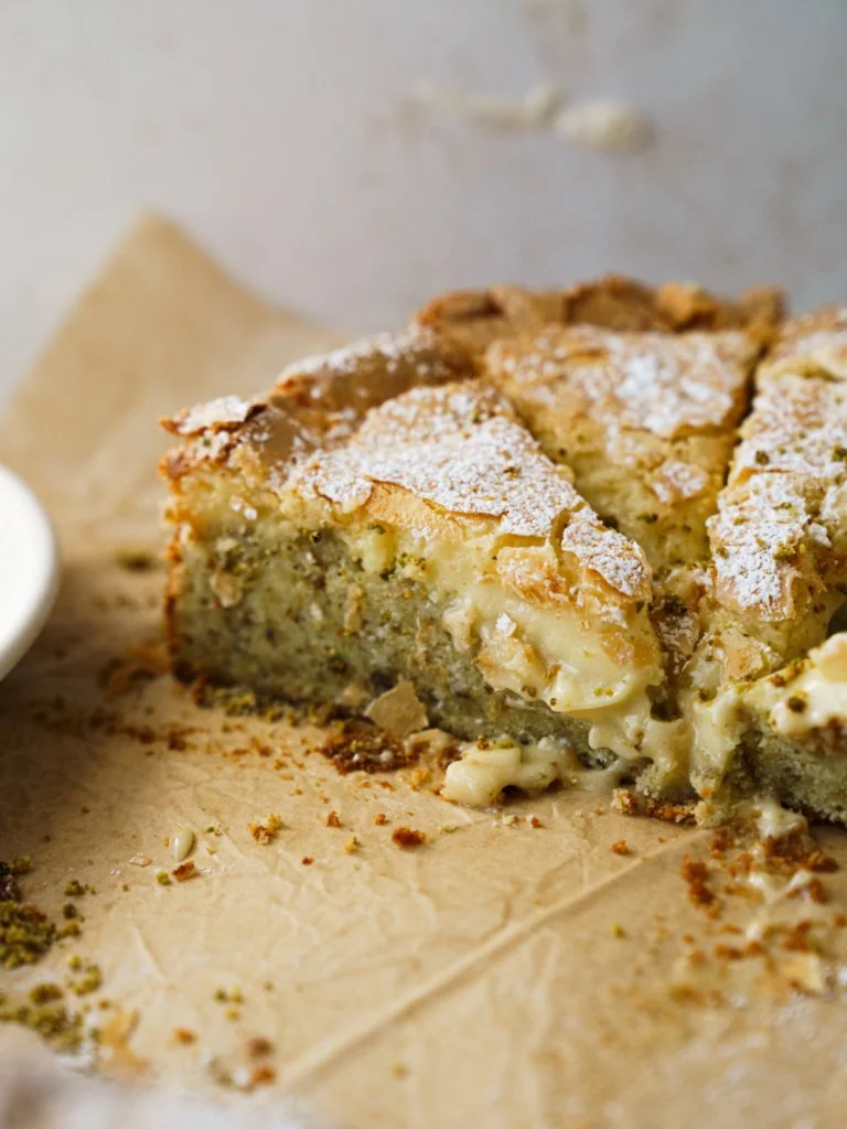 Buttery pistachio gooey butter cake slice with a rich green topping