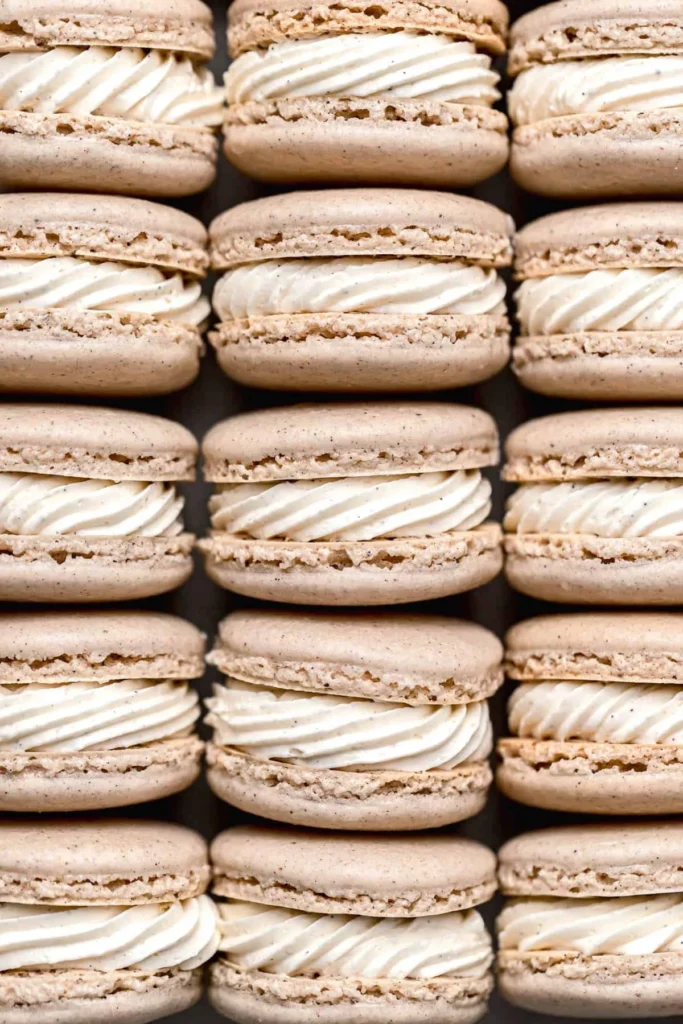 Chai Macarons with spices and cream filling on a decorative plate