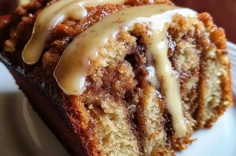 Delicious cinnamon roll banana bread with a cinnamon swirl topping
