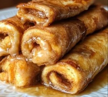 Cinnamon Roll French Toast Bites served on a plate with syrup