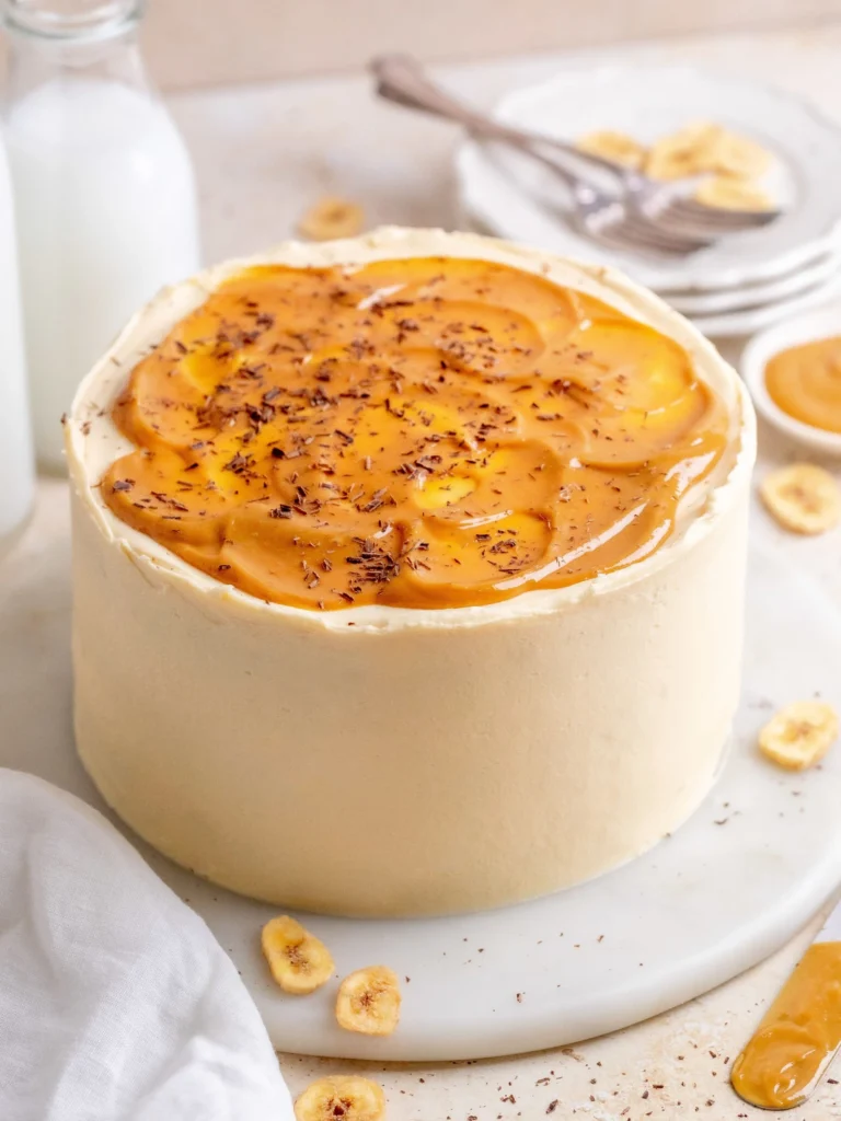A slice of decadent banoffee cake with banana and toffee toppings