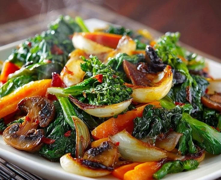 Colorful sautéed vegetables in a skillet, showcasing freshness and nutrition.