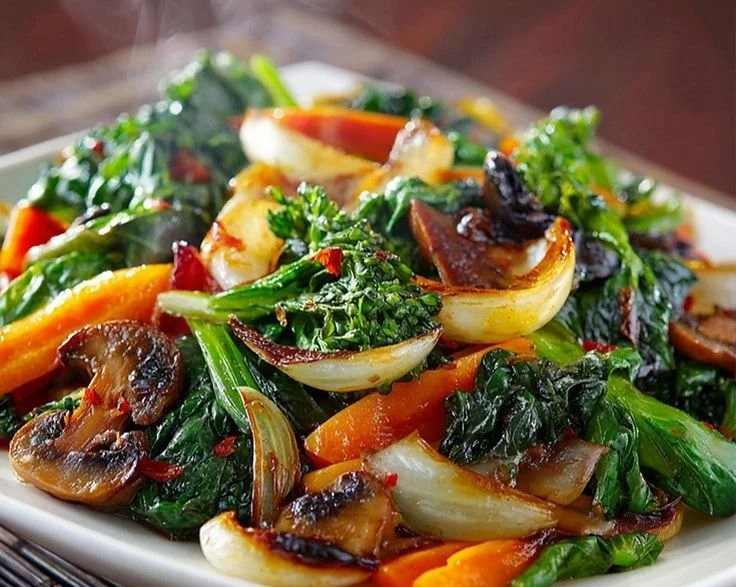 Colorful sautéed vegetables served in a dish, showcasing healthy meal options.
