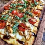 Easy Chicken Caprese Flatbread topped with chicken, tomatoes, and mozzarella cheese.
