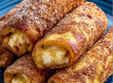 Easy cinnamon sugar French toast roll-ups served on a plate