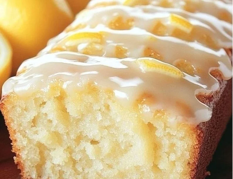 Delicious homemade copycat lemon loaf on a rustic wooden table.