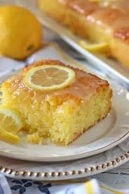 Delicious lemon cake topped with fresh lemons and icing