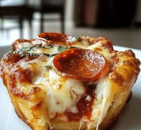 Mini Deep Dish Crescent Roll Pizzas with cheese and toppings