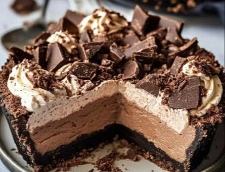 Delicious Mississippi Mud Pie topped with chocolate and whipped cream