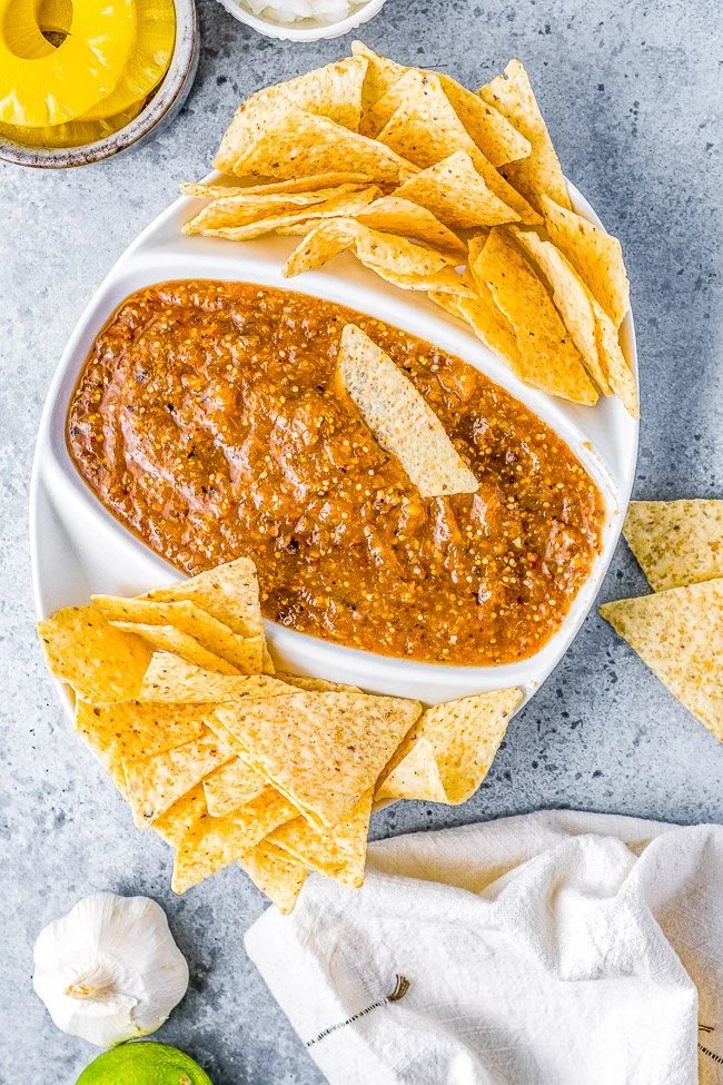 Homemade Pineapple Chipotle Salsa served in a bowl with tortilla chips.