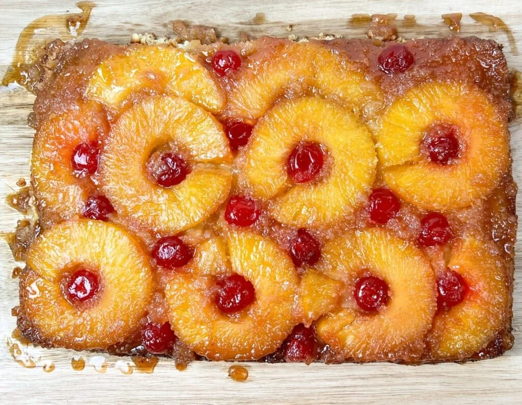 Delicious Pineapple Upside Down Cake with caramelized pineapples and cherries