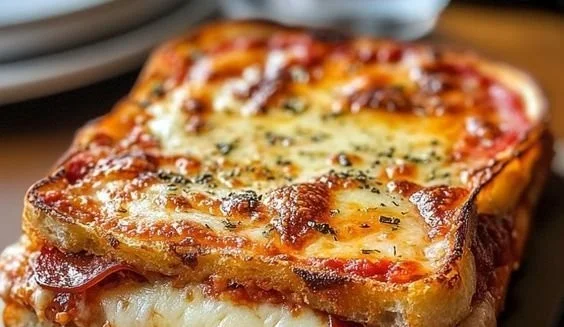 Delicious Pizza Grilled Cheese sandwich with gooey cheese and pepperoni.
