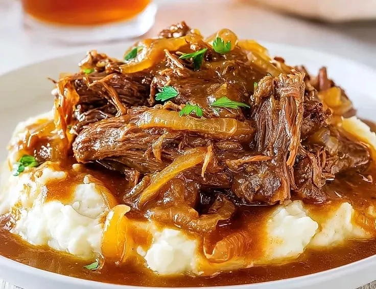 Savory French onion pot roast cooked in a crock pot with fragrant onions and tender meat.