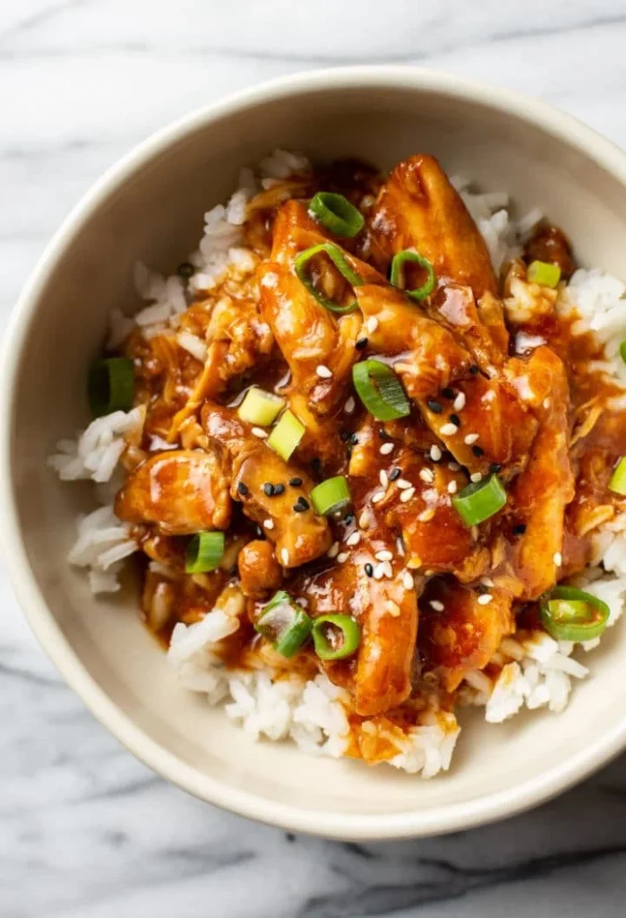 Delicious slow cooker honey garlic chicken served with rice and vegetables