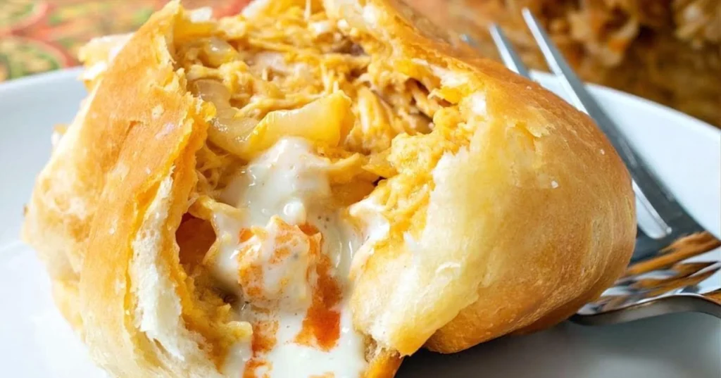 Spicy Buffalo Chicken Pockets fresh out of the oven, garnished and ready to eat.