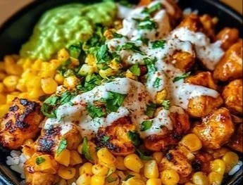 Delicious Street Corn Chicken Rice Bowl garnished with fresh ingredients