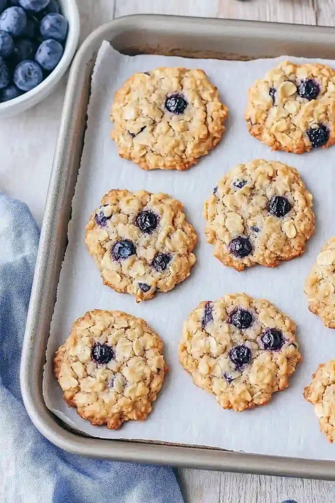 Freshly baked blueberry oatmeal cookies on a cooling rack