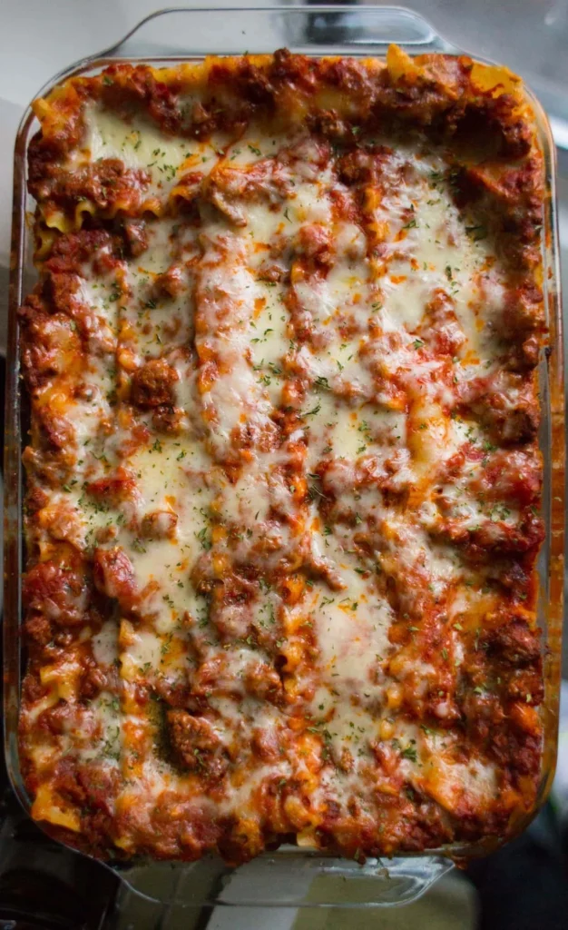 Delicious beef lasagna with layers of ricotta cheese and rich meat sauce