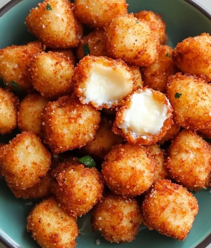 Delicious crispy mozzarella bites served with marinara sauce