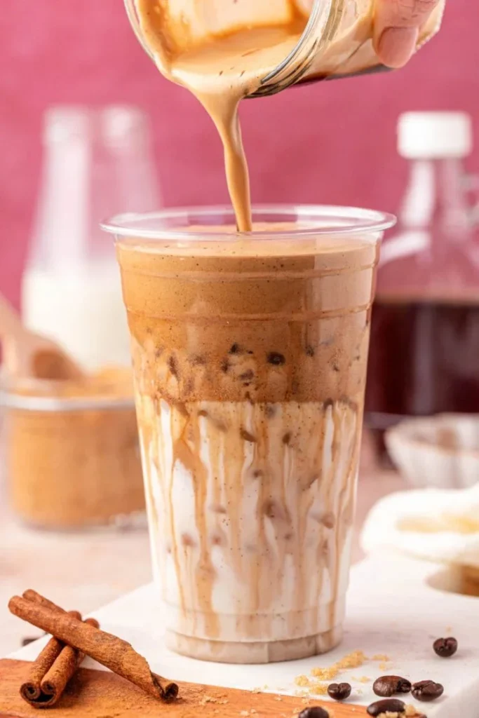 Viral French Toast Iced Latte topped with whipped cream and cinnamon garnish