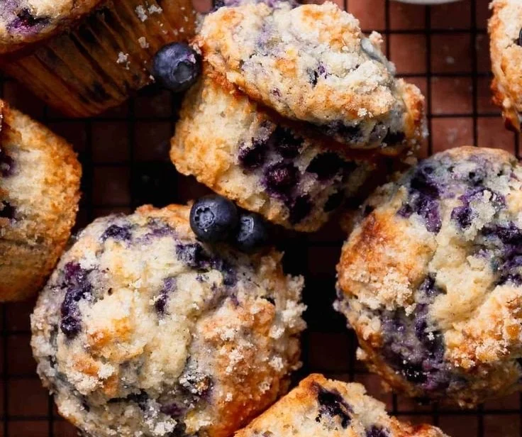 Delicious bakery-style blueberry muffins cooling on a wire rack