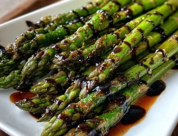 Balsamic roasted asparagus garnished and ready to serve