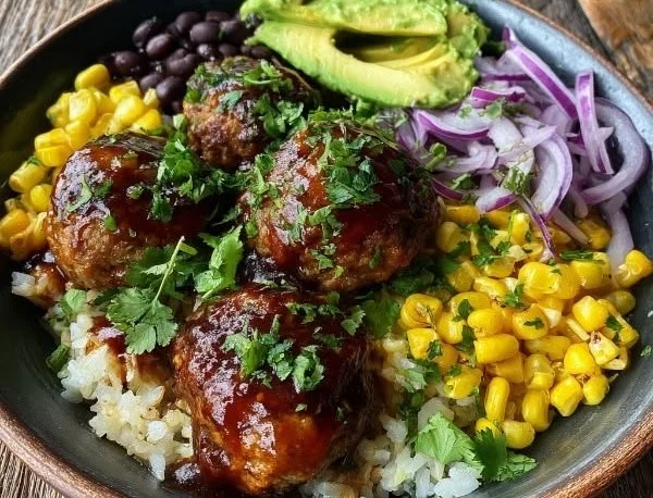 Barbecue meatball bowls served with avocado goddess sauce, a tasty meal option.