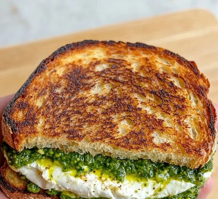 Burrata Grilled Cheese Sandwich served on a plate with golden brown crust