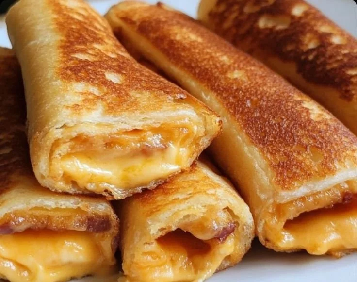 Crispy Cheesy Roll-Ups on a platter ready to serve