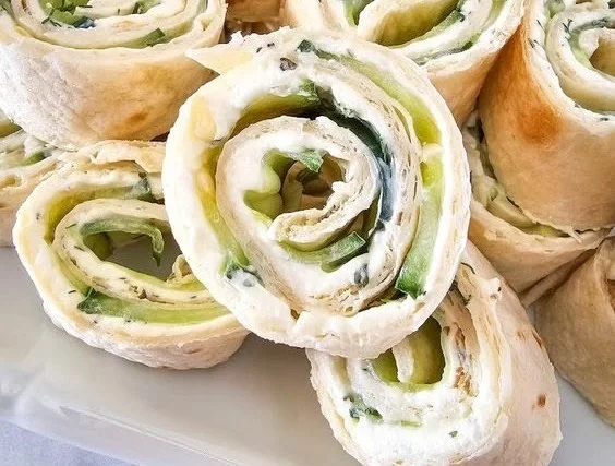 Plate of cucumber and dill pinwheels for a fresh appetizer