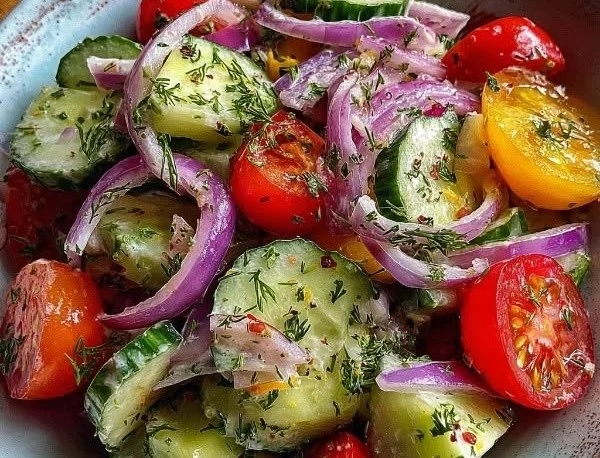 Cucumber Ranch Crack Salad topped with fresh vegetables and ranch dressing