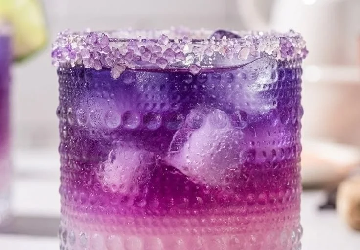 Galaxy Margarita cocktail with colorful layers and a starry presentation.