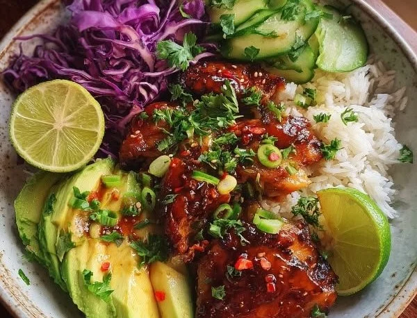 Hot Honey Chicken Bowl topped with spicy honey sauce and fresh vegetables