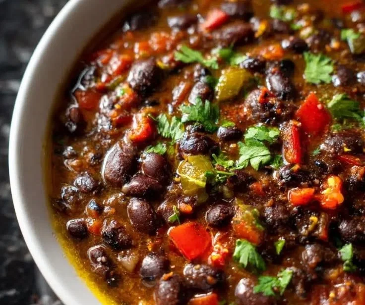 Delicious bowl of minute black bean soup with jalapeño