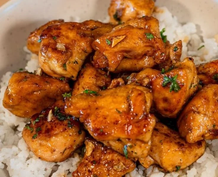 Delicious Minute Honey Garlic Chicken Bites garnished with herbs