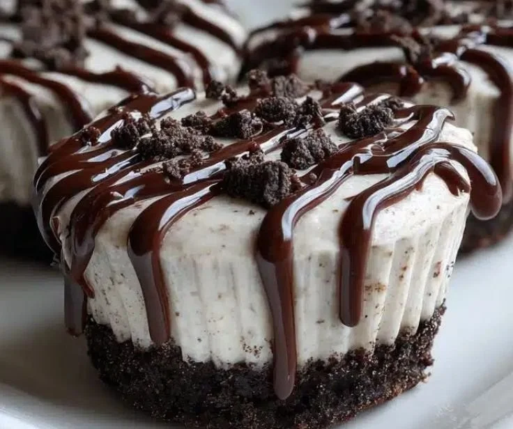 No-Bake Mini Oreo Desserts topped with crushed Oreos and whipped cream.