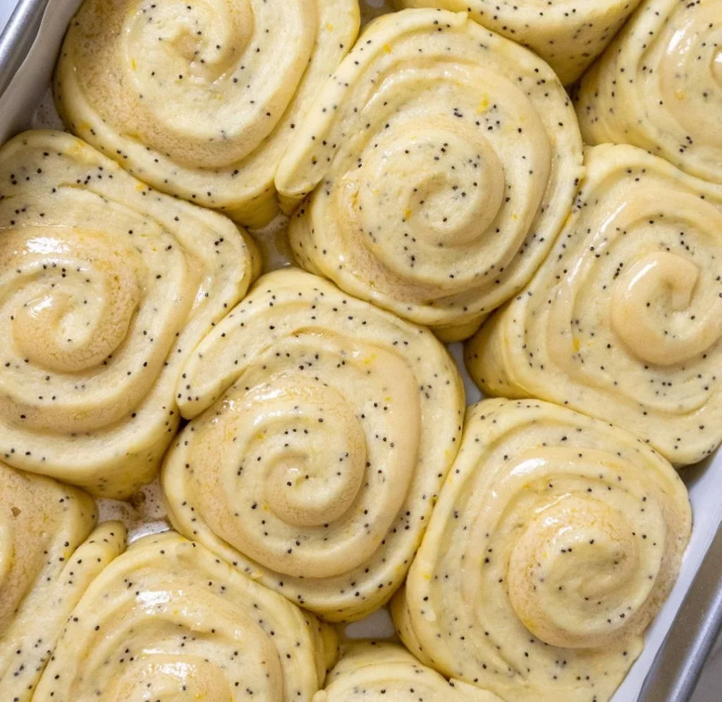 Freshly baked Poppy Seed Lemon Rolls with a zesty lemon glaze