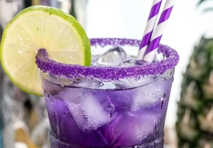 Purple Rain Cocktail in a glass with vibrant colors