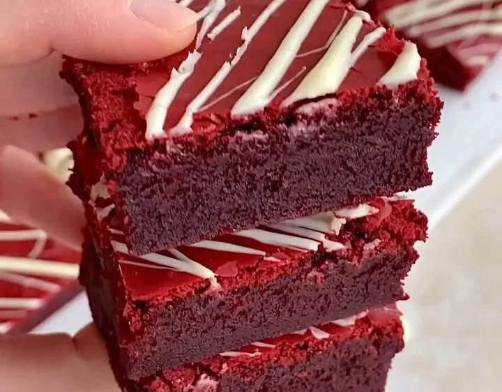 Delicious Red Velvet Brownies topped with cream cheese frosting