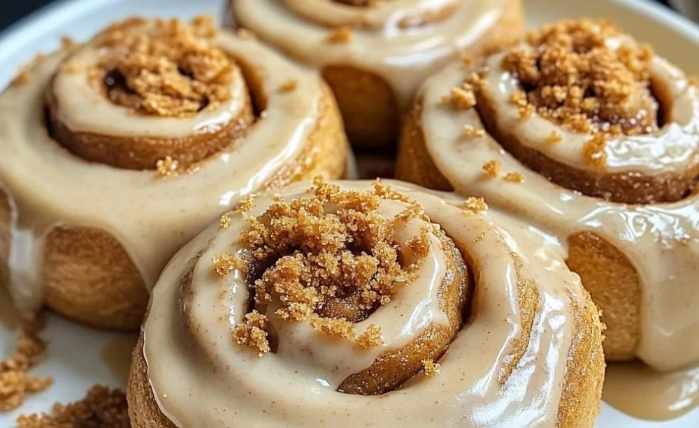 Soft and fluffy Biscoff cookie butter cinnamon rolls ready to be enjoyed