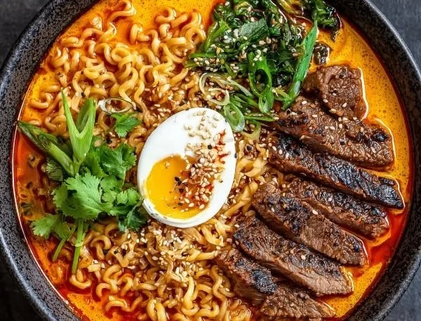 Spicy Korean ramen bowl with grilled beef and creamy sauce